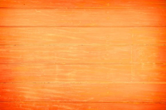 Elevating Visual Identity with an Orange-Brown Wooden Background